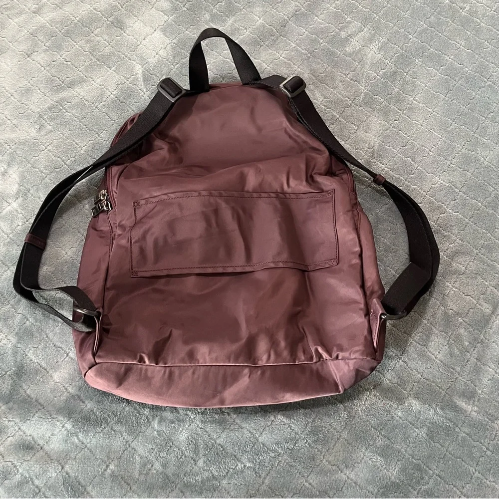 Tumi‎ maroon Backpack with Classic Design and Durable Build